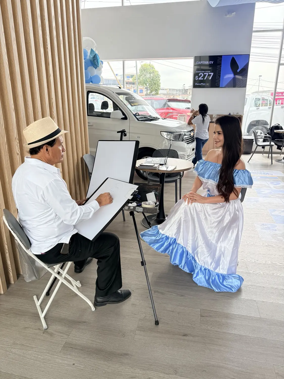 Artista realizando un retrato en vivo durante una activación